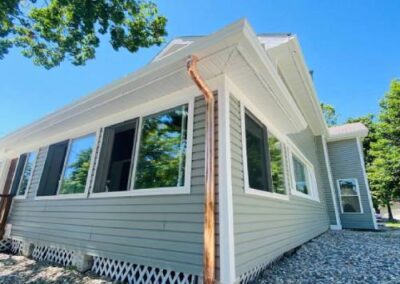 White Gutter Installation with Copper Gutters